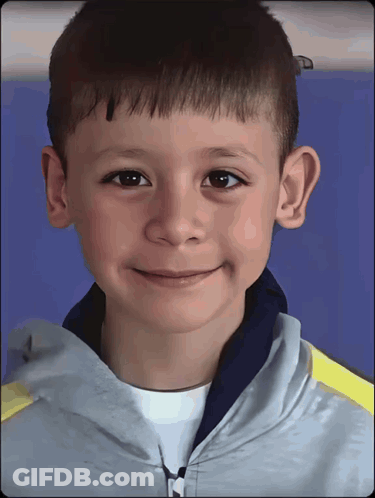 Young Boy In Grey Jacket With M GIF