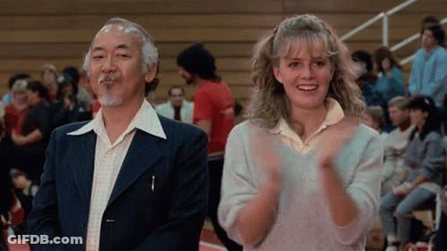 Young Boy In Karate Uniform Facing Crowd GIF