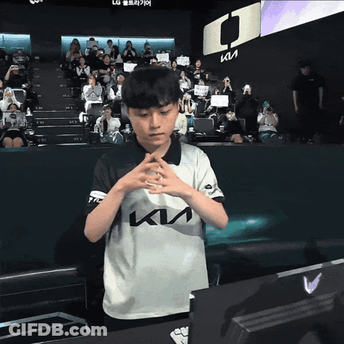 Young Boy In Kia Shirt Before Crowd GIF