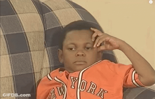 Young Boy In New York Jersey Sitting On Couch GIF