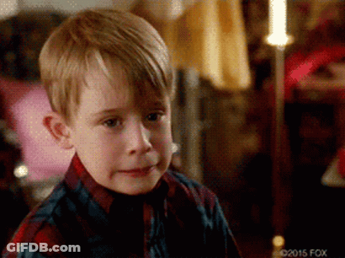 Young Boy In Plaid Shirt Making A Face GIF