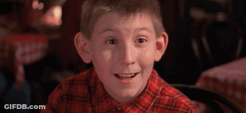 Young Boy In Plaid Shirt Smiling GIF