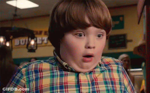 Young Boy In Plaid Shirt Surprised By Buffet Sign GIF