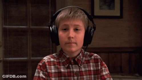 Young Boy In Plaid Shirt Wearing Headphones GIF