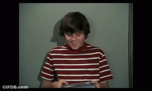 Young Boy In Red And White Striped Shirt Smiling GIF