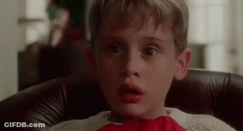 Young Boy In Red Bow Tie And Sweater GIF