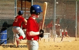 Young Boy In Red Jersey Holding Baseball Bat GIF