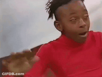 Young Boy In Red Shirt Making Funny Face GIF