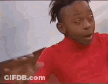 Young Boy In Red Shirt Making Funny Face GIF
