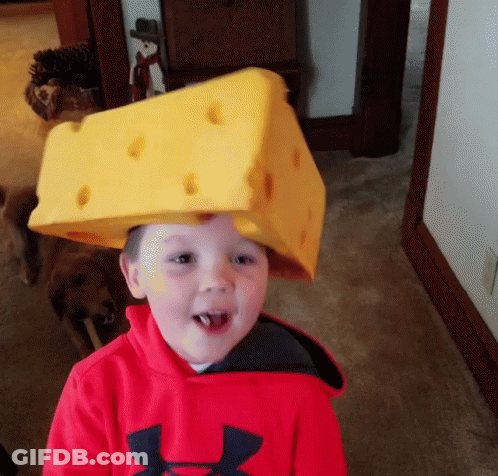 Young Boy In Red Under Armour Sweatshirt With Cheese Hat GIF