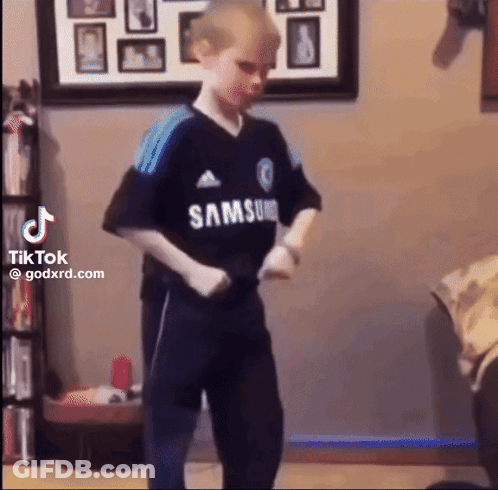 Young Boy In Samsung Shirt Dancing In Living Room GIF