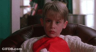 Young Boy In Santa Hat And Red Scarf GIF