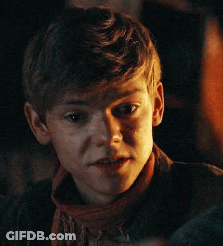 Young Boy In Scarf And Jacket Making Funny Face GIF