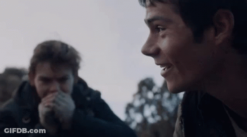 Young Boy In Scarf And Jacket Making Funny Face GIF