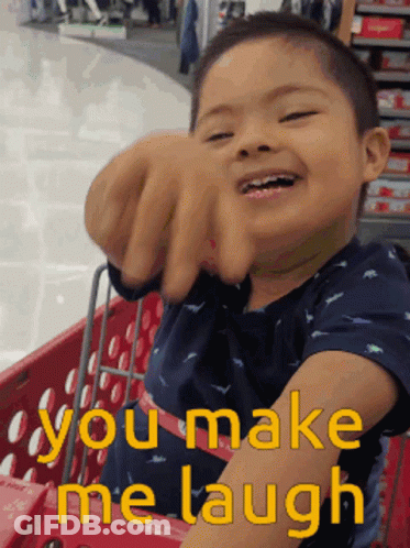 Young Boy In Shopping Cart Saying You Make Me Laugh GIF
