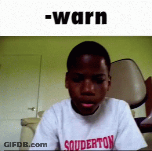 Young Boy In Souderton T-Shirt Sitting In Front Of Chair GIF