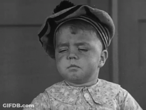 Young Boy In Striped Hat And Floral Shirt Waving GIF