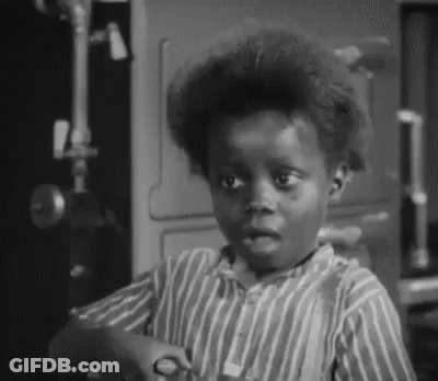 Young Boy In Striped Shirt Holding Scissors GIF