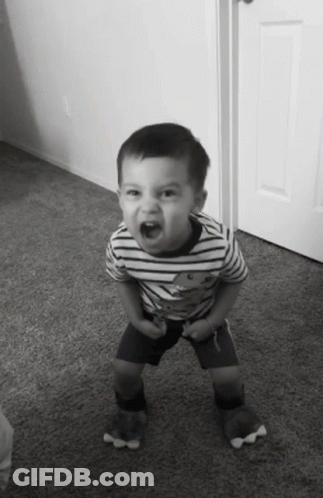 Young Boy In Striped Shirt With Teddy Bear Pumping Fist GIF