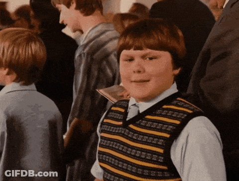 Young Boy In Striped Vest In Crowd GIF