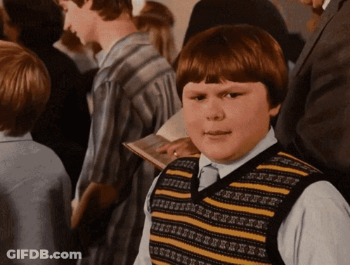 Young Boy In Striped Vest With Letter E GIF