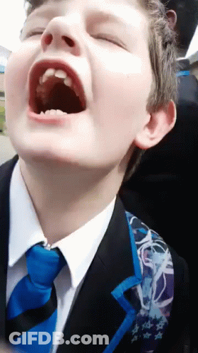 Young Boy In Suit And Tie With Mouth Open GIF