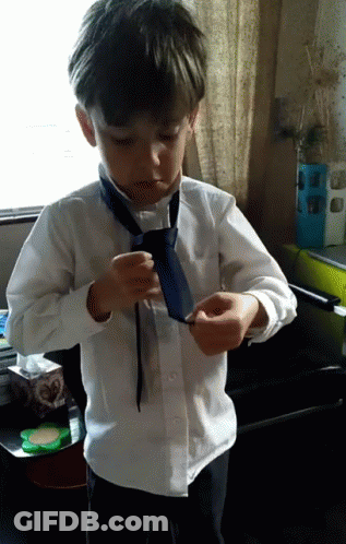 Young Boy In White Shirt And Blue Tie GIF