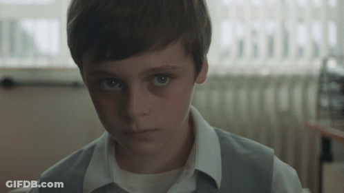 Young Boy In White Shirt And Gray Vest GIF