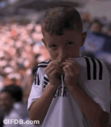 Young Boy In White Shirt With Letter R GIF