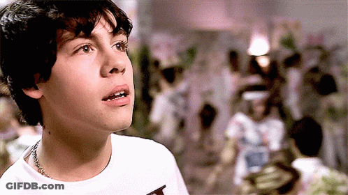 Young Boy In White Shirt With T GIF