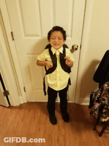 Young Boy In Yellow Shirt And Black Pants GIF