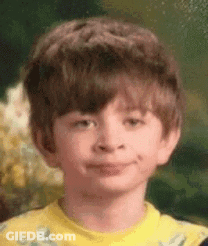 Young Boy In Yellow Shirt Making Funny Face GIF