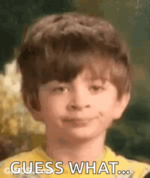 Young Boy In Yellow Shirt Smiling Guess What GIF