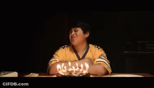 Young Boy In Yellow Shirt With Birthday Cake GIF
