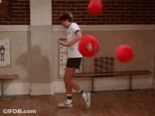 Young Boy Jumping With Red Balls GIF
