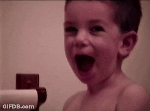 Young Boy Laughing In Bath GIF