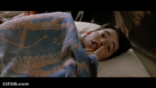 Young Boy Laying In Bed With Whale Blanket GIF