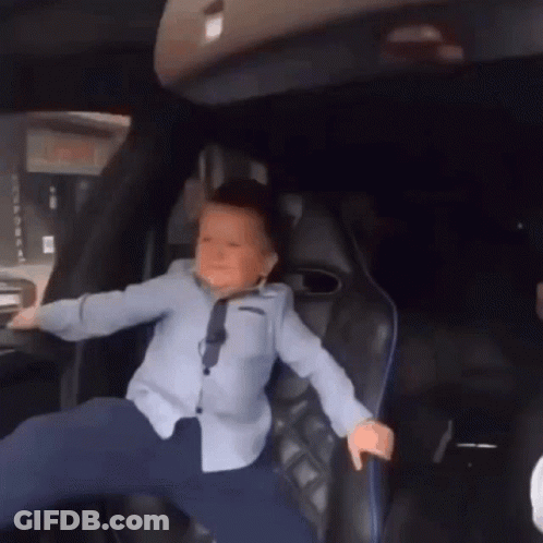 Young Boy Legs Crossed In Back Seat GIF