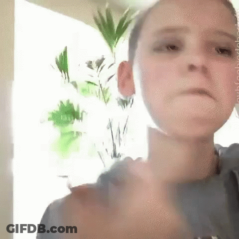 Young Boy Making Funny Face And Thumbs Up GIF