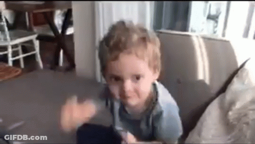 Young Boy Making Funny Face On Couch GIF