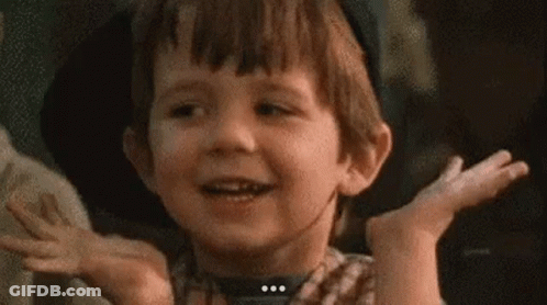 Young Boy Making Funny Face With Hands Outstretched GIF