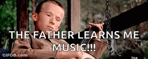 Young Boy On Swing With The Father Learns Me Music GIF