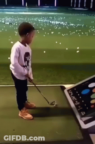 Young Boy Playing Golf GIF