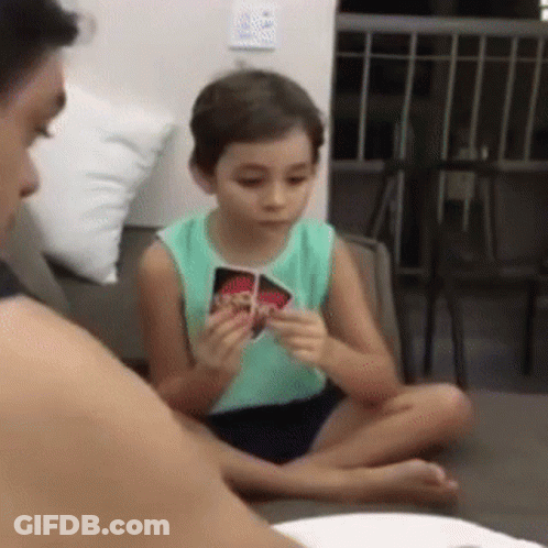 Young Boy Playing Uno With Mother GIF