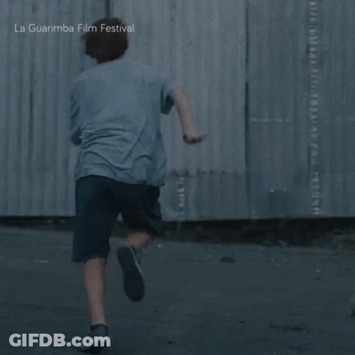 Young Boy Running In Front Of La Guarimba Festival GIF