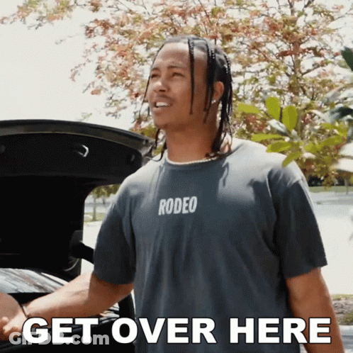 Young Boy Running On Football Field With Players GIF