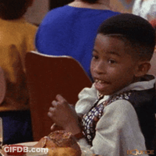 Young Boy Sitting At Table With Food And Sauce GIF