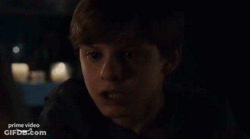 Young Boy Sitting In Car At Night GIF