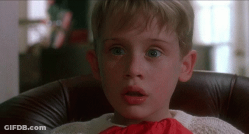 Young Boy Sitting In Chair With Mouth Open GIF
