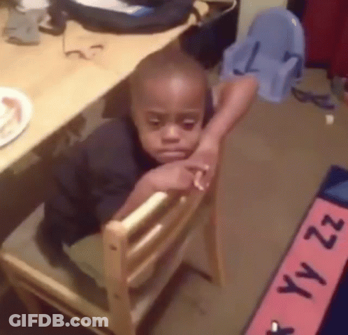 Young Boy Sitting In Wooden Chair Head Resting GIF
